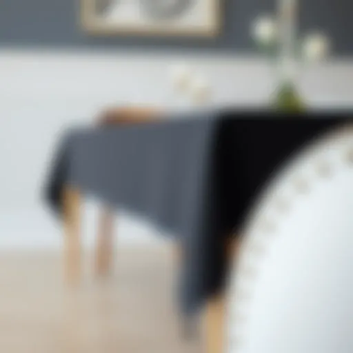 Elegant black tablecloth draping over a wooden dining table